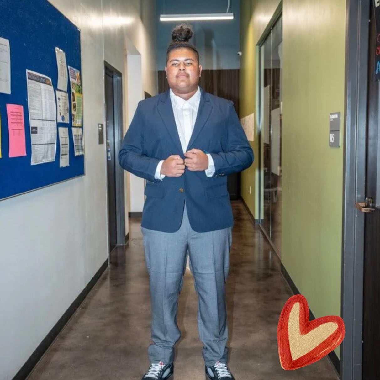 Legacy student wearing a formal navy uniform jacket